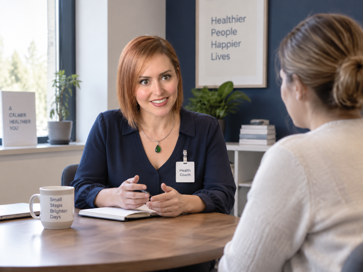 A health coach in conversation with a client in a consultation room